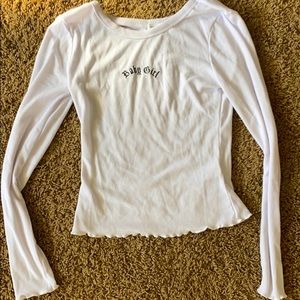 white long sleeve - says “Baby girl”